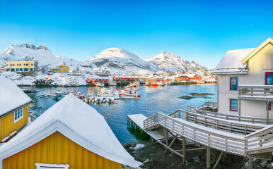 Fototapeta na wymiar Marvelous snowy morning cityscape of Sorvagen town and port.