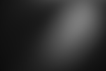Dark black and gray blurred  gradient background has a little abstract light.