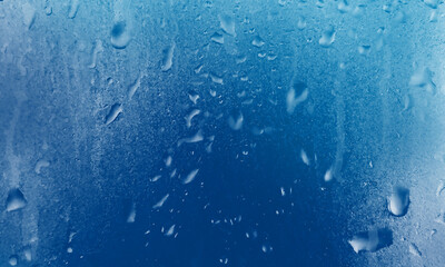 Raindrops on black glass. Condensation water drops.	

