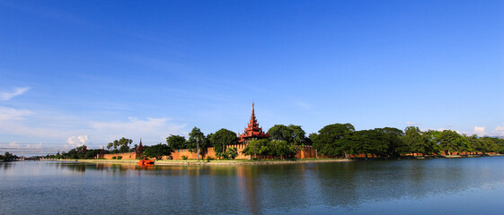 Fototapeta na wymiar Ancient royal Palace, surrounded by a moat. Myanmar Mandalay.