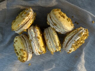 lilikoi passionfruit macaron cream filled sandwich cookies textured praline surface - 541594704