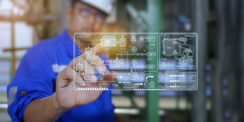 An engineer in a refinery is inspecting the equipment in the refinery by looking at the hologram diagram shown on the front. Technology concepts and work in industrial plants.