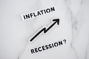 inflation with arrow going up and recession texts with question mark underneath, economic issues...