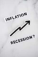 inflation with arrow going up and recession texts with question mark underneath, economic issues after the pandemic