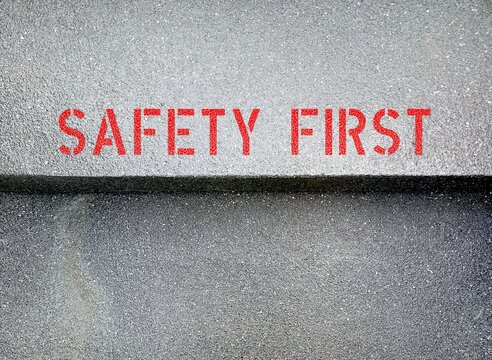 Stairs Cement Background With Red Text Inscription SAFETY FIRST , Concept Of Keeping Free From Harm Or Unnecessary Danger - Self Awareness Affirmation To Stay Safe In Daily Life