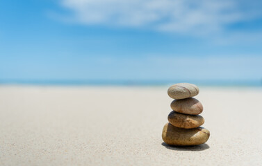 Fototapeta na wymiar Stones balanced on beach. Zen stones meditation and relaxation. Japanese zen garden