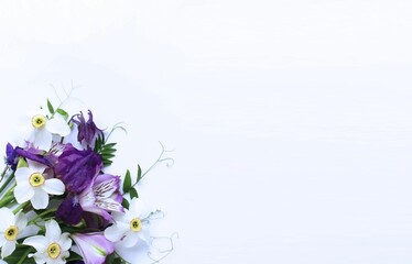 Spring flower arrangement - white daffodils, lilac Alstroemeria, purple irises on a white background. Background for greetings, invitations, and postcards.