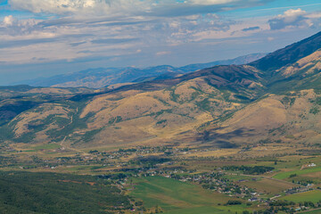 Summer mountain landscape in the USA. Sunny day and cloudy sky, Village view from the top of the rock. High-quality photo