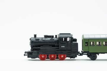 Black locomotive with reed wheels. Vintage train toy