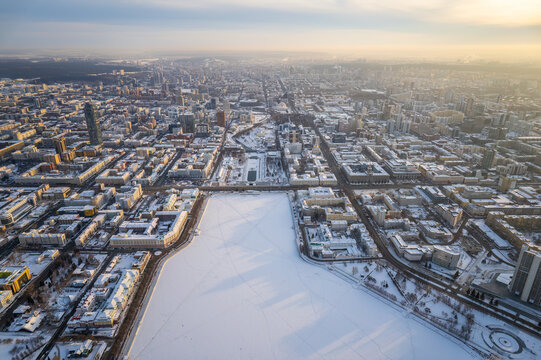 Embankment of the central pond and Plotinka in Yekaterinburg at winter sunset. The historic center of the city of Yekaterinburg, Russia, Aerial View