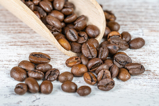 Macrophotography of coffee beans roasted naturally to enjoy their aroma and flavor.