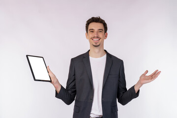 Portrait of attractive cheerful businessman using device app searching web isolated over white color background