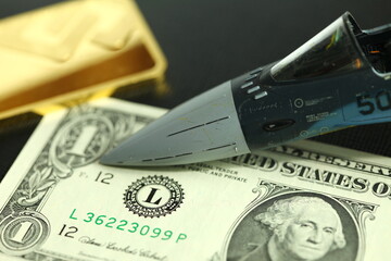 Banknote plastic model plane head and gold bar represent wealth and money system concept related idea. 
