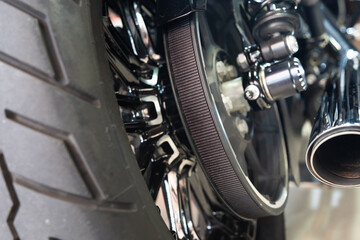 Motorcycle rear belt drive at garage, belt drive reduces maintenance and quieter than chains. maintenance,repair motorcycle concept