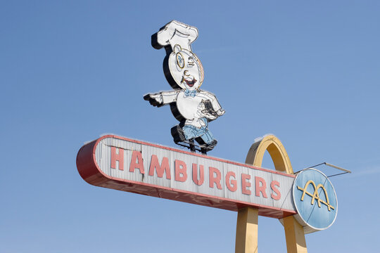 Downey, CA, USA - May 10, 2022: The vintage sign featuring Speedee, McDonald's original mascot, is seen at the oldest remaining McDonald's restaurant in Downey, California, outside of Los Angeles.