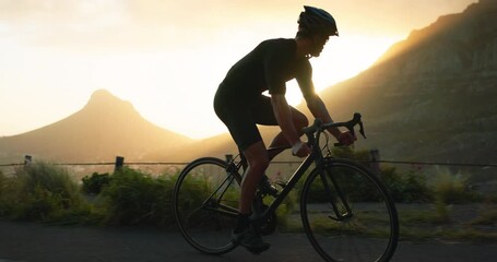 Bicycle, mountain and man cycling on road with sunrise, summer and nature landscape. Inspiration, wellness and motivation in sports, cyclist riding a bike in morning for fitness, workout and exercise - Powered by Adobe