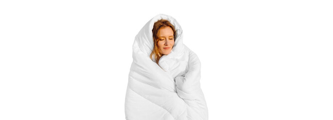 A pretty redhead girl, wrapped in a snow-white blanket, sits on the bed. Keep warm with a warm...