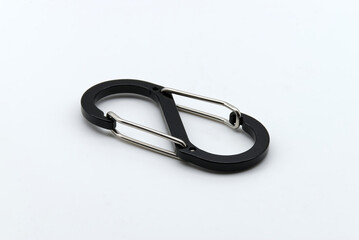 Fototapeta premium Black and silver carabiner isolated on white background