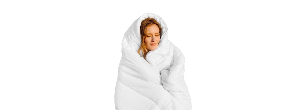 A pretty redhead girl, wrapped in a snow-white blanket, sits on the bed. Keep warm with a warm blanket. Laziness. Banner, isolated on white background. copy space. High quality photo - Powered by Adobe