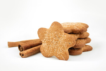 Ginger cookies asterisk with sugar, cinnamon on a white blurred background. Christmas Sweets recipe