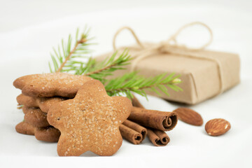 Ginger cookies asterisk with sugar, cinnamon on a white blurred background. Christmas Gift
