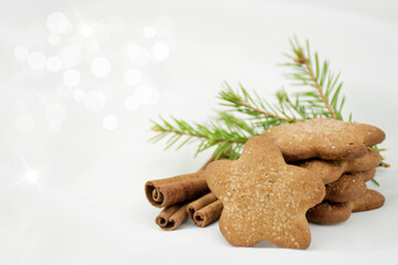 Ginger cookies asterisk with sugar, cinnamon on a white blurred background. Christmas Gift