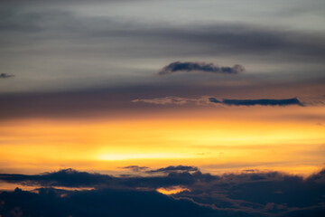 Fototapeta premium The dramatic colors of the sunset in the sky gradient from blue to orange.