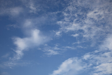 blue sky and clouds Bright blue sky on a day where clouds float high at the end of the rainy season in Thailand