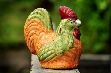 Chicken piggy bank made of clay selective focus