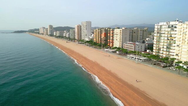 Aerial images of the seafront of Playa de Aro on the Costa Brava in Girona blue sky sunny day in summer beach without people