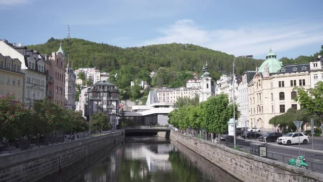 Karlovy Vary or Carlsbad and Hot Spring Colonnade, panning view from bridge on Tepla river, Czech Republic