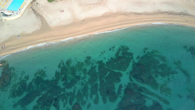 Aerial shot of an impressive beach with transparent water on the Costa Brava in Girona Playa de Aro and S'Agar&oacute;