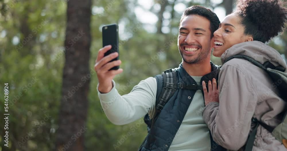 Sticker Hiking, selfie and young couple in forest smiling, happy and enjoy nature together. Fitness, wellness and Asian man with black woman taking picture with phone on adventure, trekking and walk in woods