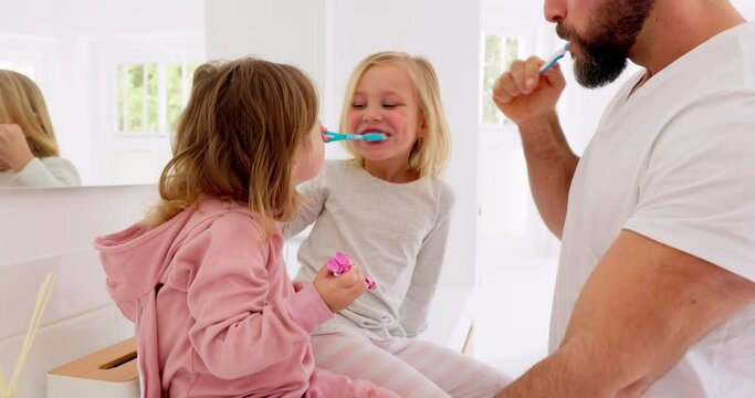 Father, kids and brushing teeth dental healthcare, cleaning and bathroom hygiene in family home. Happy dad teaching young girl children oral wellness with toothpaste, toothbrush and healthy lifestyle