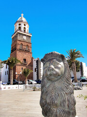 clocktower and lion at central market square in Teguise, Lanzarote