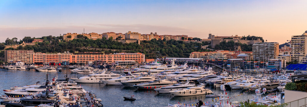 Monte Carlo Cityscape And Luxury Yachts In Harbor Of Monaco, Cote At Sunset