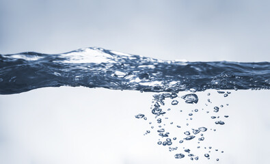 Water splash Aqua flowing in waves and creating bubbles Drops on the water surface feel fresh and...