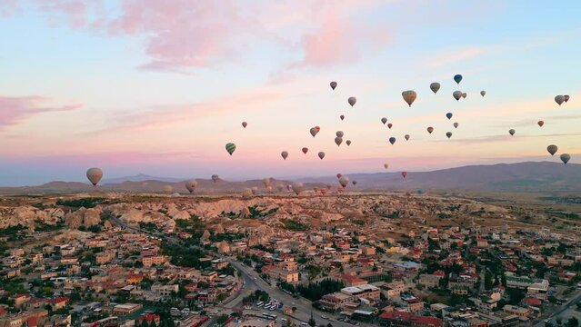 Stunning panorama of Cappadocia - Turkish city with amazing rock formations, caves and hot-air balloon festival. Summertime adventures for adventurous people. High quality 4k footage