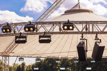 Stage Modern Lighting Equipment - Searchlight, Lamps, Projector, Laser, Lights on Sky Background