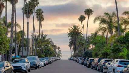 Panorama Puffy clouds at sunset Vehicles parked on the asphalt road near the bay area at La Jolla,...