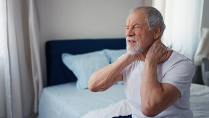 Senior man suffering neck pain.