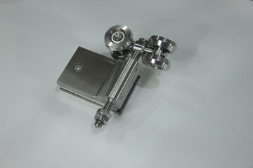 Door hinges made from metal on white background. Silver industrial tools object photo.