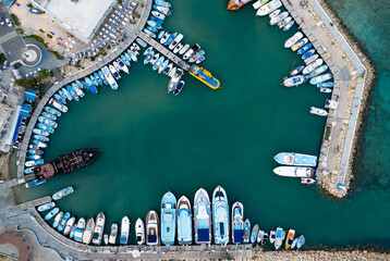 Aerial view of boats and yachts moored in a marina. Drone view from above. Ayia Napa Cyprus
