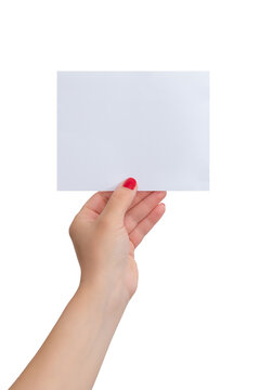 Woman's hand holds a small blank sheet of paper. Isolated background. Paper mockup for text presentation