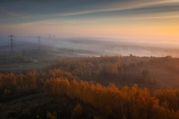 Beautiful landscape with morning fog over the forest in Poland