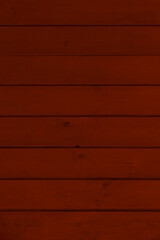 Obraz premium dark reddish wooden wall made of planks background