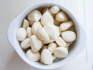 Garlics of white plate. Close-up