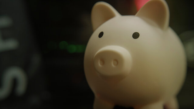Blurred piggy bank post focus on after, background image for font