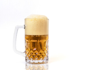 glass mug full of beer with foam cap on top, isolated on white background