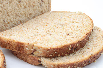 Close-up sliced ​​wholemeal bread, on white background
